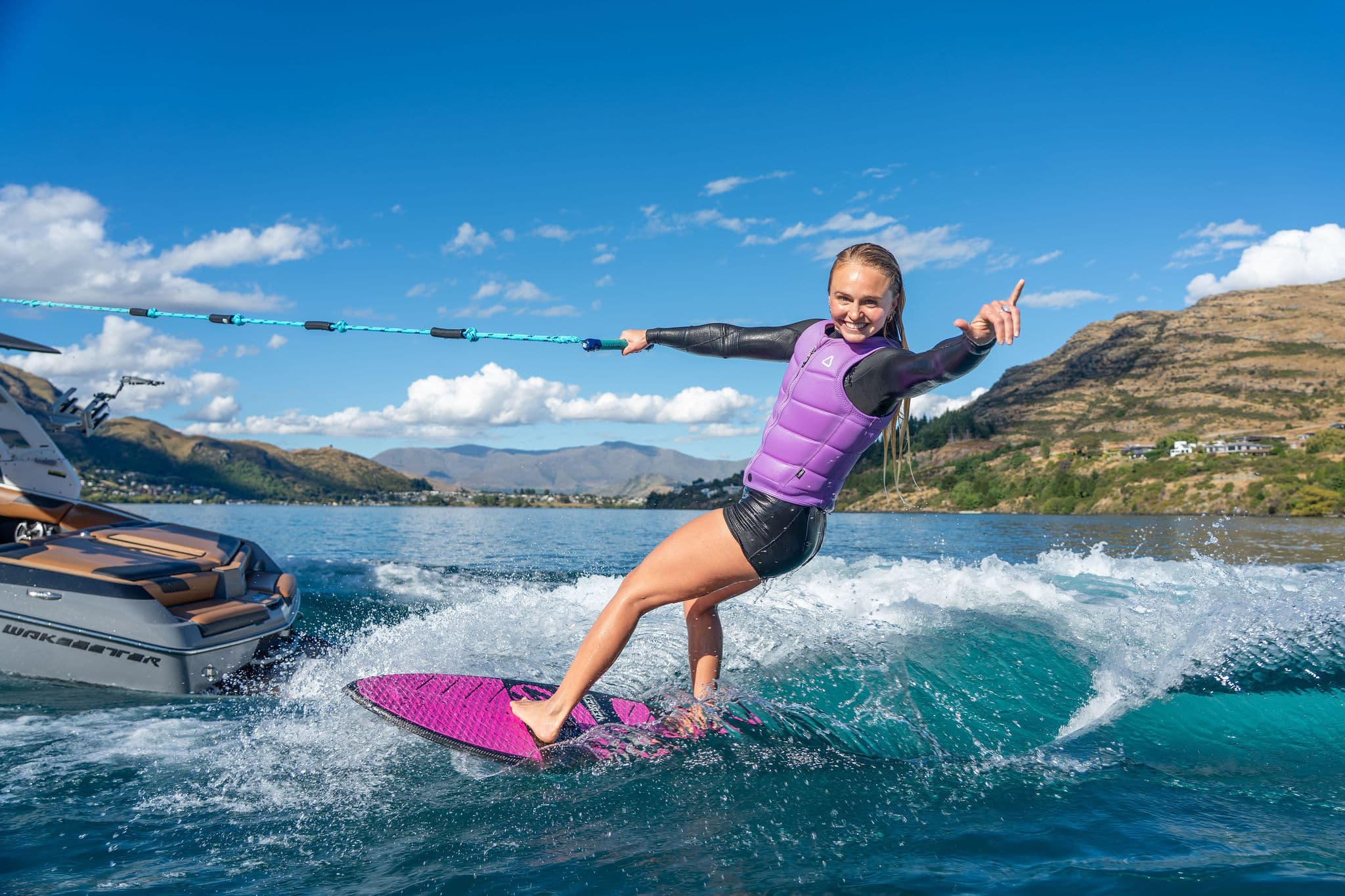 Coach Emma Galusha riding the wave with the rope in one hand